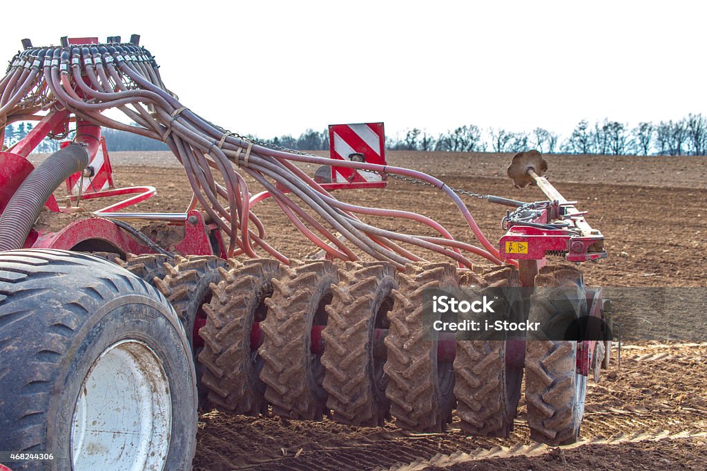 Field works The tractor working on the large field 2015 Stock Photo