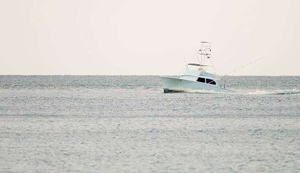 istock White Fishing Boat on Dreary Day 468244878