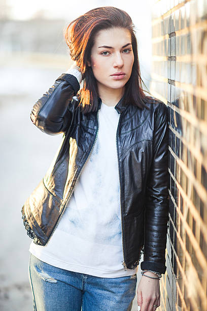 istock Young woman outdoors portrait. Soft sunny colors. 468250848