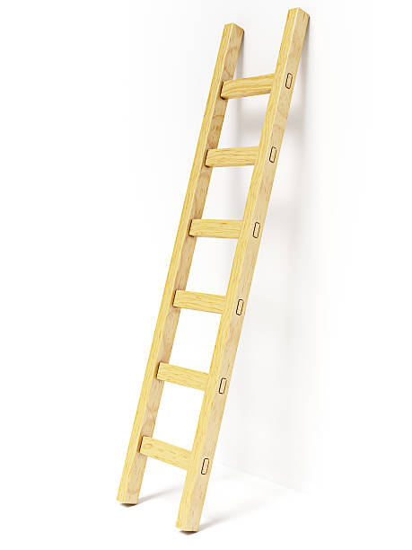 istock Wooden ladder near white wall 468250976