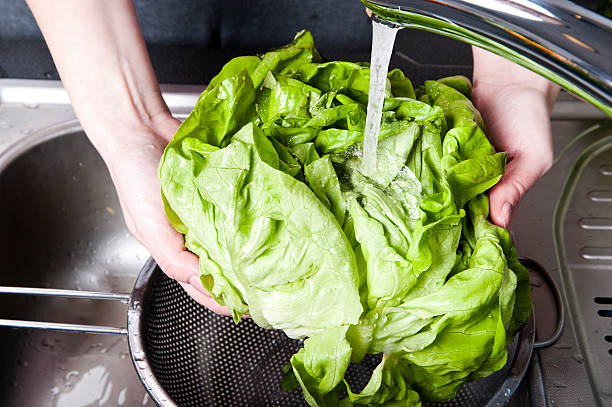 istock Fresh salad splashing in water before cooking 468251417