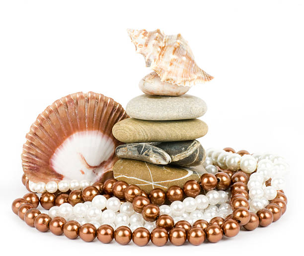 Pearls on a white background with beautiful shells stock photo