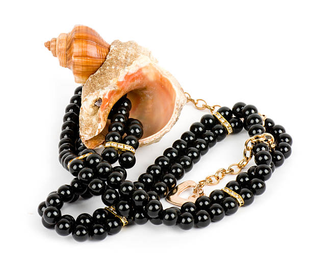 Beautiful shell and black pearls stock photo