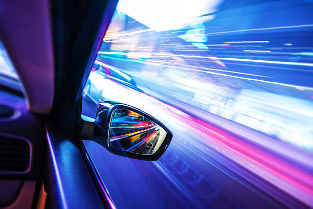Car in Motion at Night Car in Motion at Night. Colorful Motion Blurs. Transportation Concept Photo. street racing stock pictures, royalty-free photos & images