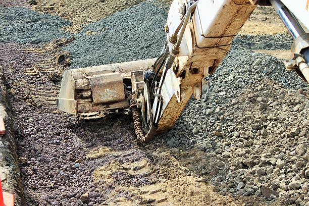 istock Ground digger head amongst the gravel its clearing 468261172
