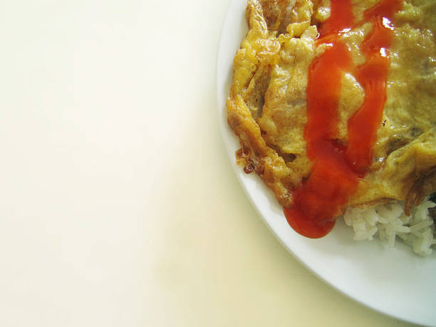 istock rice topped with omelet with sauce 468263730