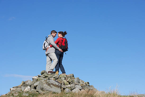 istock Walkers Standing On Pile Of Rocks 468267505