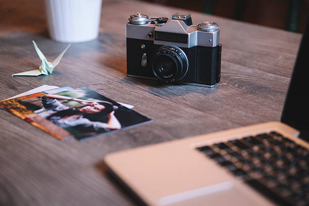 istock Photographer's equipment on desk 468267604