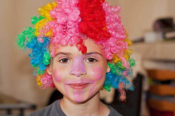 istock Child with clown wig 468269523