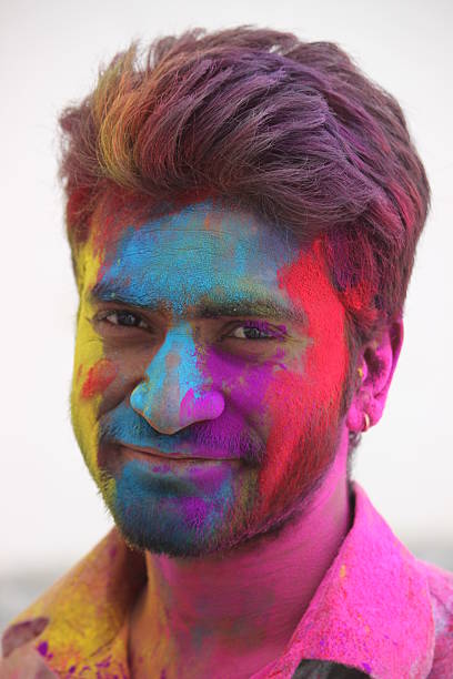istock Being Colorful - a multicolored face of indian young man 468270894