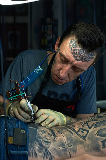 Portrait of tattoo master Closeup portrait of tattoo master shoulder tattoo designs for men stock pictures, royalty-free photos & images