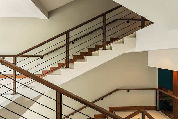 istock staircase with wooden rail in a modern building 468277212