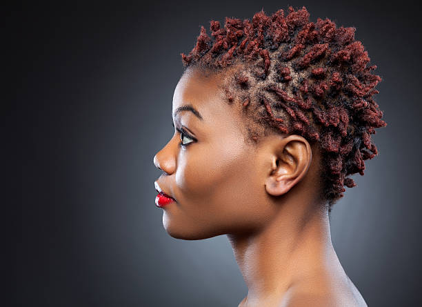 A Black Beauty With Spiky Short Hair In A Dark Background Stock Photo -  Download Image Now - iStock