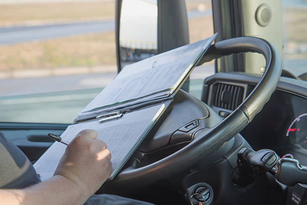 istock Truck driver is writing in the documentation. 468290248