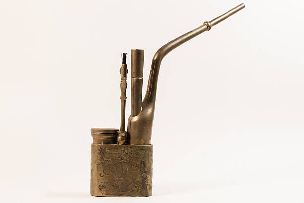 Still life of an old Chinese Brass Tobacco Water Pipe stock photo