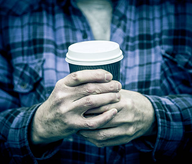 istock Senior adult hands holding disposable coffee cup 468297420