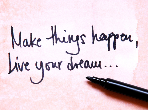 text make things happen live your dream handwritten on old paper