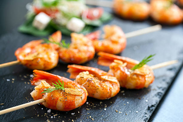 istock Appetizing grilled prawns on skewer. 468299990