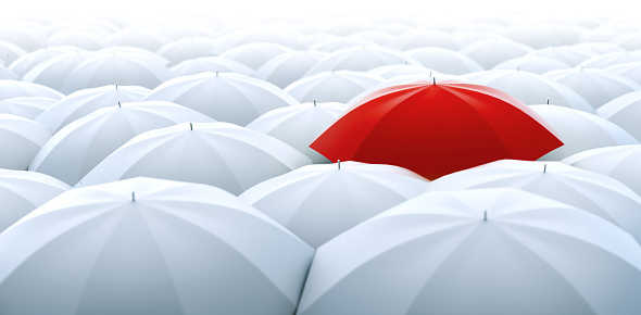 Improved, better and bigger size image of different, leader, best, unique, boss, individuality, original, special, worst, first, chief, champion and discrimination concept. Red umbrella in a row of white ones
