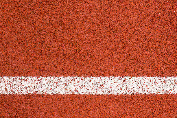 Abstract running track background. Running track with white striped on redbrick color background. lane marker stock pictures, royalty-free photos & images