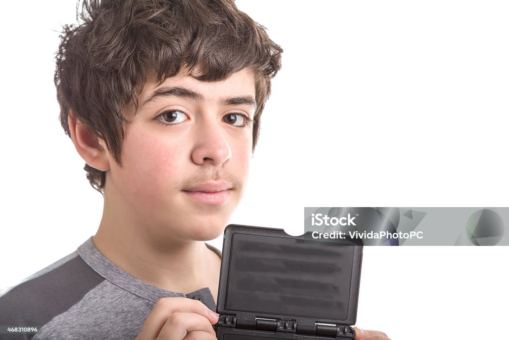 Calm and confident Caucasian smooth-skinned boy with blank black Calm and confident Caucasian smooth-skinned boy wearing a grey sweatshirt  holds a  blank black plastic sign 2015 Stock Photo