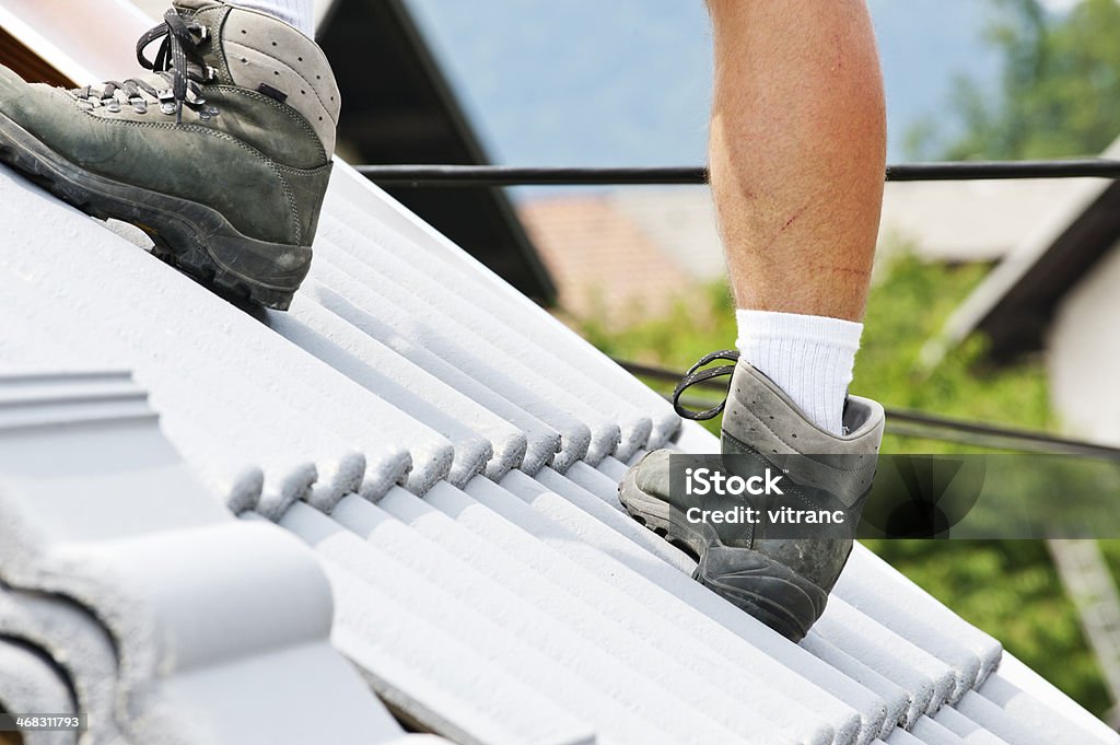 Dangerous Jobs Roofer in new roof Adult Stock Photo