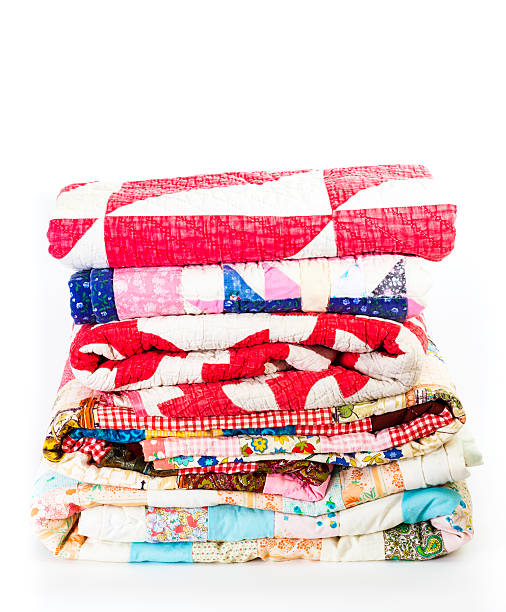 Stack Of Colorful Old Quilts stock photo