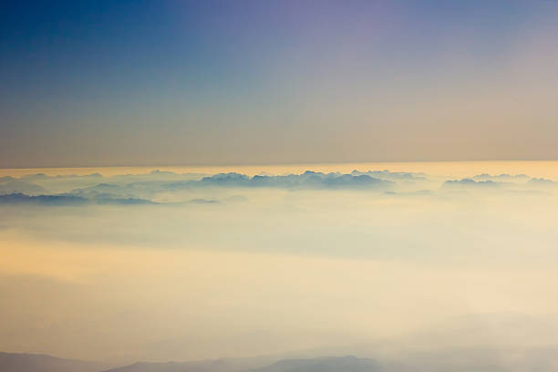 istock White clouds in blue sky. Aerial view from airplane 468322864