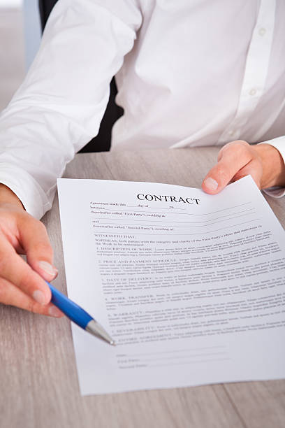 istock Businessman's Hand Holding Pen And Contract 468326109