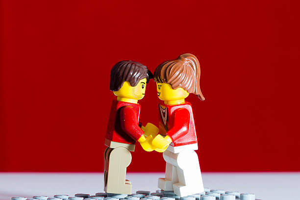 Aalter,Belgium - February 2, 2015: two lego figures, male and female in a red and white background