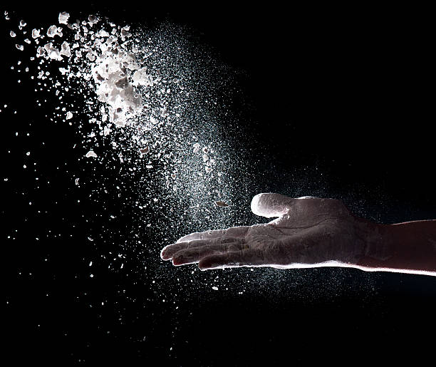 istock Hand and flour on black background 468326616