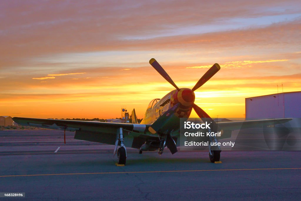 P-51 Mustang Airplane sunrise at 2015 Los Angeles Air Show Los Angeles, California,USA-March 21,2015. P-51 Mustang vintage WWII airplane at sunrise before the start of the 2015 Los Angeles Air Show at Fox Field,Lancaster,California. The 2015 Los Angeles Air Show features 2 days of military and civilian aircraft performing. The main event of each day was the US Air Force Thunderbirds Flight Demonstration Squadron. 2015 Stock Photo