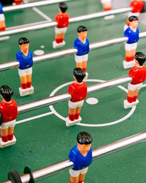 istock Red and Blue Table Football Players Arranged around Centre Circle 468332072