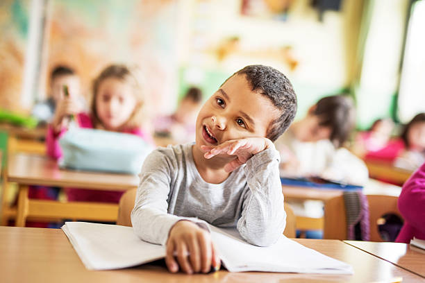 istock Bored African American schoolboy in the classroom. 468332248