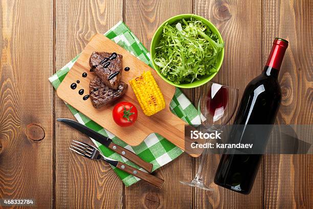 Steak With Grilled Corn Salad And Red Wine Stock Photo - Download Image Now - 2015, Beef, Bottle