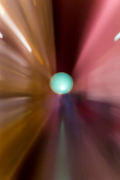 Close-up view of a large group of multi colored balloons. Retail display. Clear blue sky background. Blurred motion.  Lugo city, Galicia, Spain during San Froilán traditional festival.