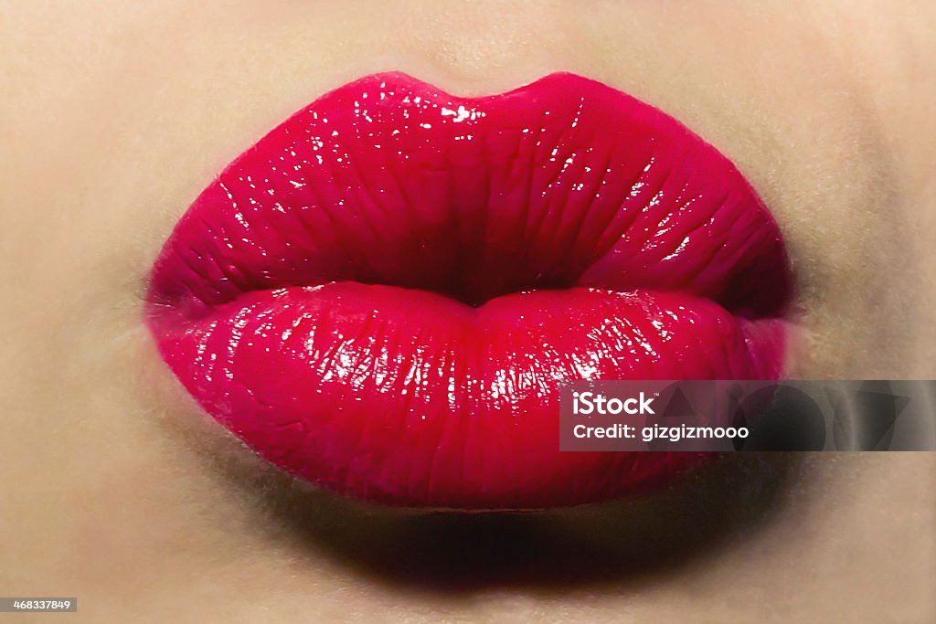 Woman with puckered lips and red lipstick Kiss Human Lips Stock Photo