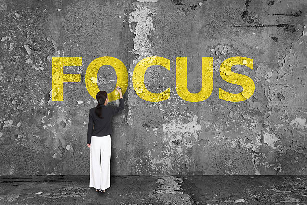 istock business woman drawing focus on wall 468340832