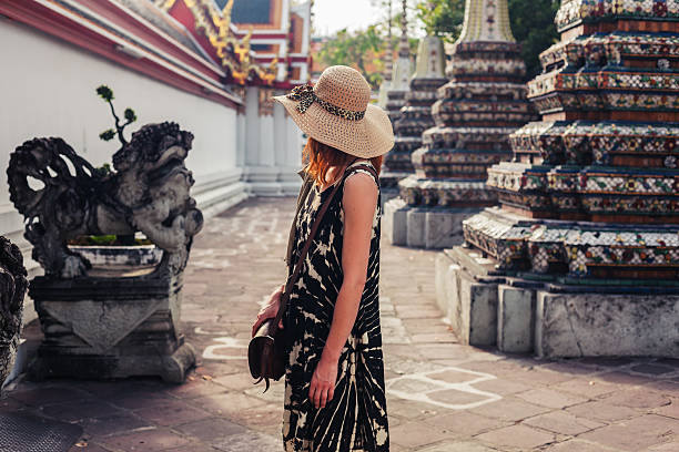 istock Woman exploring buddhist temple 468341552