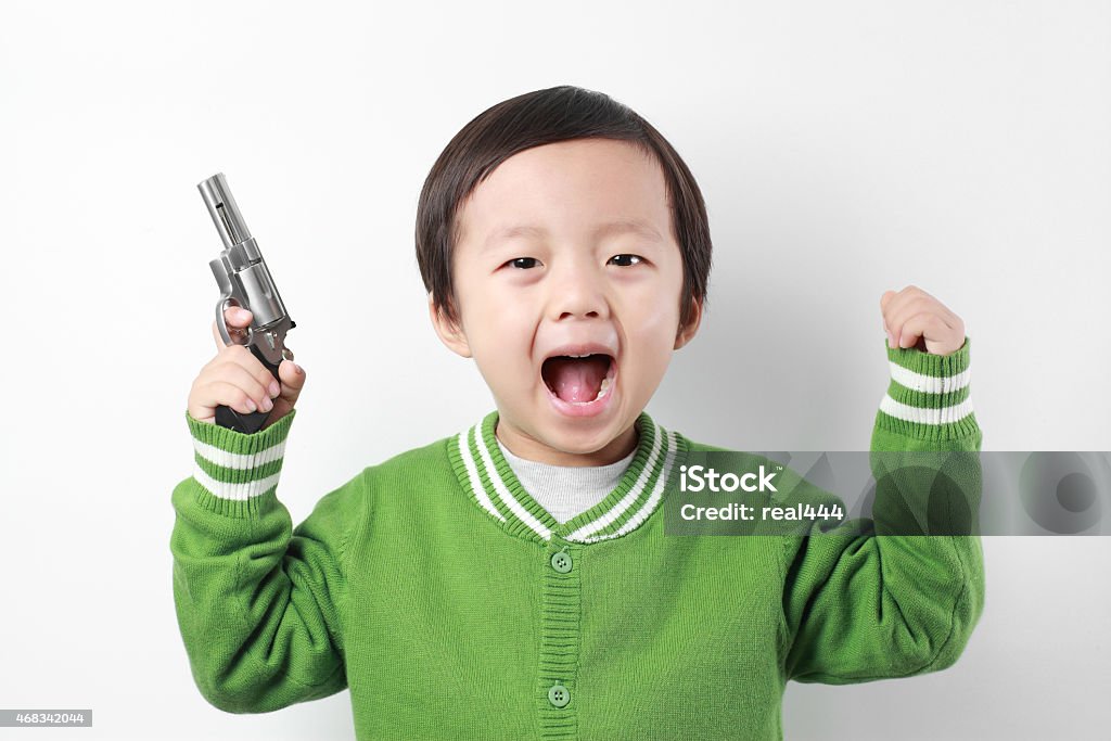 Cute asia children playing with toy gun Cute asia children 2-3 Years Stock Photo