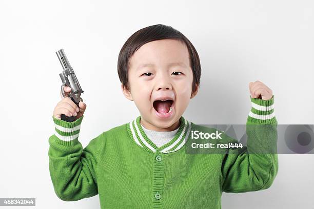 Cute Asia Children Playing With Toy Gun Stock Photo - Download Image Now - 2-3 Years, 2015, Adult