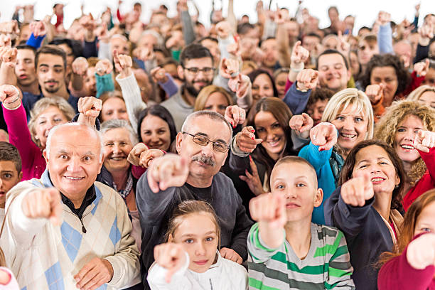 istock Large group of happy people pointing at the camera. 468342500