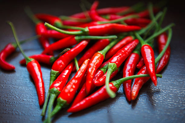 istock Hot Thai Red Chili Peppers on table 468346085