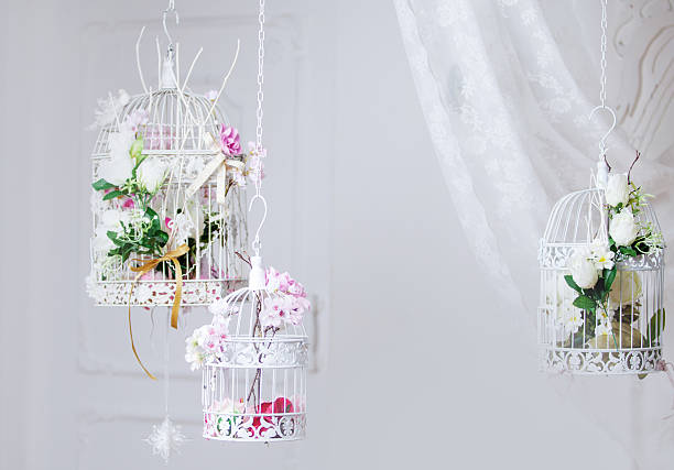 istock White decorative cage with beautiful flowers, suspension cells 468346312