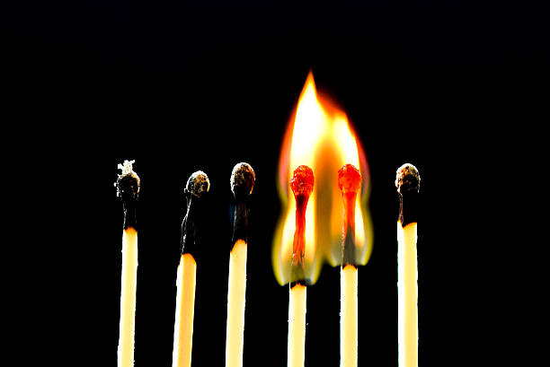 istock Burning row of matches, flying fire 468346372