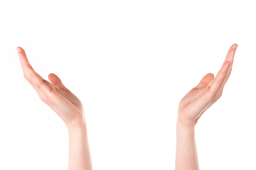 female hands holding up something isolated on white