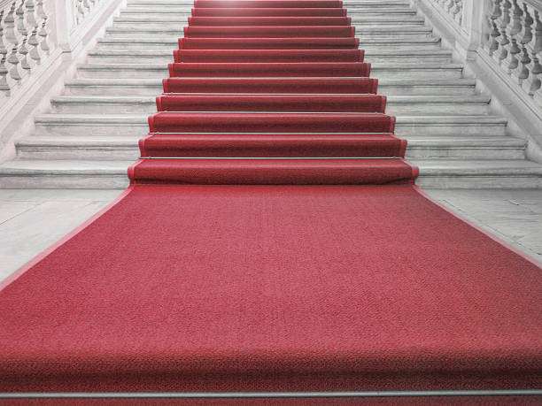 Red carpet Red carpet on a stairway used to mark the route taken by heads of state, vips and celebrities on ceremonial and formal occasions or events causeway photos stock pictures, royalty-free photos & images