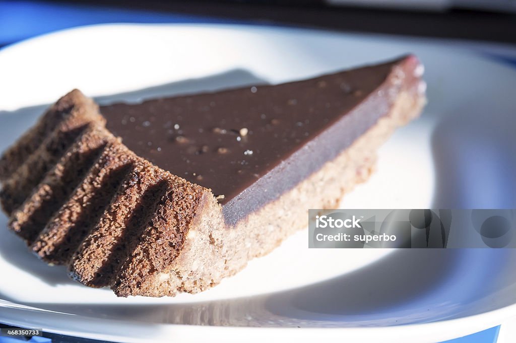 Dark chocolate cake Dark chocolate cake in the morning light Chocolate Pie Stock Photo