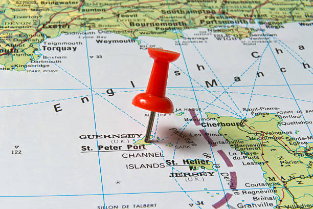 St Peter Port Guernsey Marked With Pushpin Section of the United Kingdom and the English Channel on a map with bright red pushpin in St. Peter Port, Guernsey. Pushpin is in an angle. guernsey city stock pictures, royalty-free photos & images
