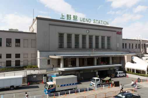 Tokyo, Japan - September 26, 2013: People walk past the Ueno Station. It is located in 7 Ueno, Taito Ward, Tokyo, Japan. It is a major railway station in Tokyo. The current station was built in 1932.